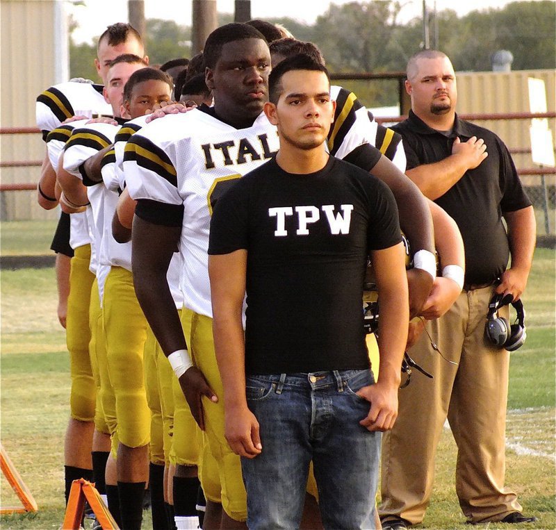Image: Braulio Luna sports TPW (Tough People Win) across his chest as the Gladiators stand in formation during the anthem.