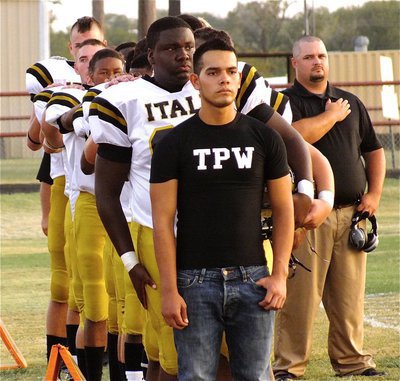 Image: Braulio Luna sports TPW (Tough People Win) across his chest as the Gladiators stand in formation during the anthem.