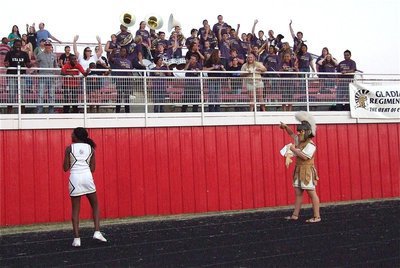 Image: Lady Gladiator Cheerleader K’Breona Davis and mascot Reagan Adams toss shirts and miniature footballs into the bleachers after a Gladiator touchdown!
