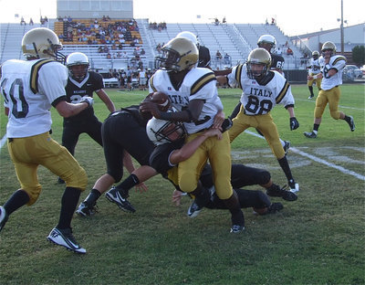 Image: Marvin Cox(2) gains several yards before being tackled by a Tiger defender.