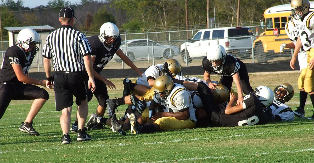 Image: Justin Robbins(64) recovers a fumble for Italy.