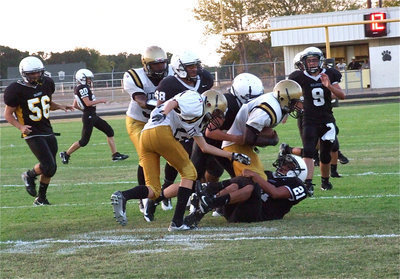 Image: Ty Windham(12) blocks downfield for Marvin Cox(2) who is on the move.