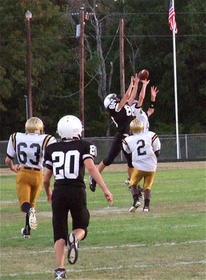 Image: Ryan Connor(13) rises for an interception against the Tigers.