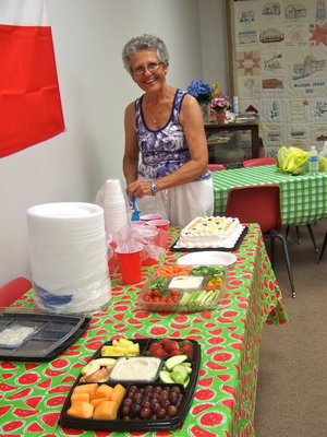 Image: Arveal sets up the refreshment table.