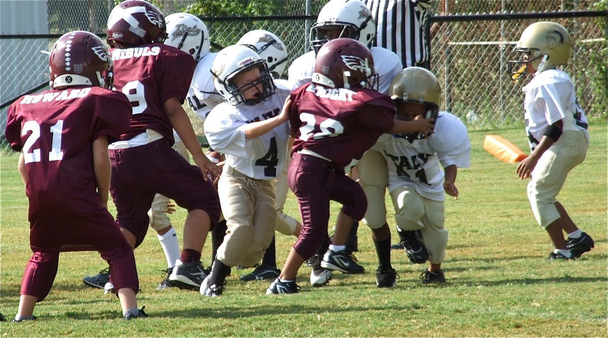 Image: Dustyn Duke(4) and Xavier Alverez(21) execute a double team block to perfection against Mildred. The IYAA C-Team offensive blockers were relentless in their attack on Saturday, propelling Italy’s youngest football playing Gladiators to a 21-0 victory!