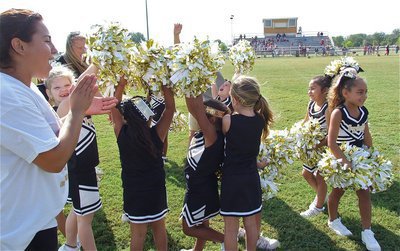 Image: The IYAA C-team cheerleaders celebrate their team’s opening day win over Mildred.