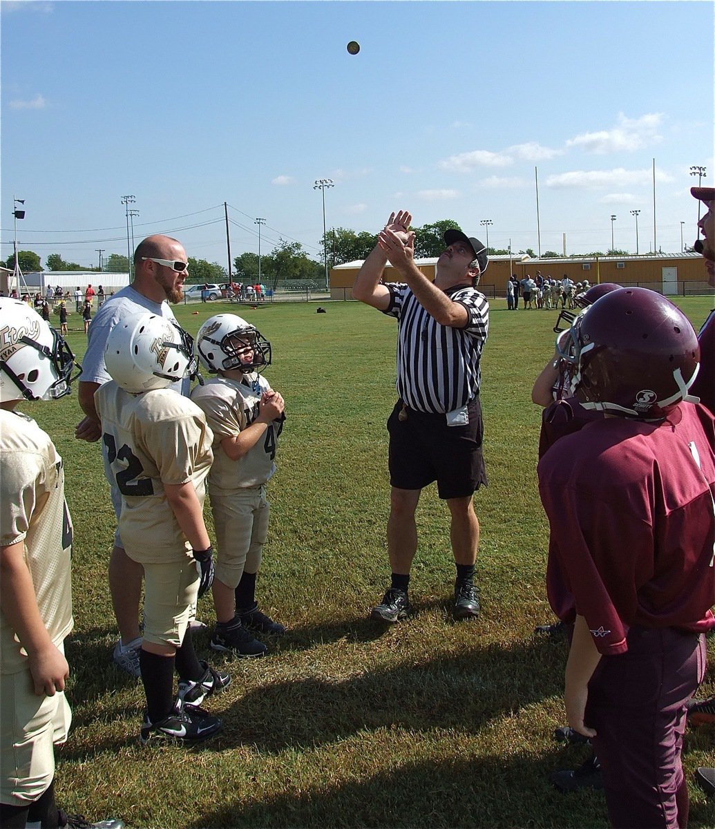 Image: The IYAA B-Team Gladiators watch the coin toss before the game.