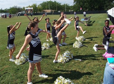 Image: The IYAA B-team Cheerleaders show their skills after a cheer.