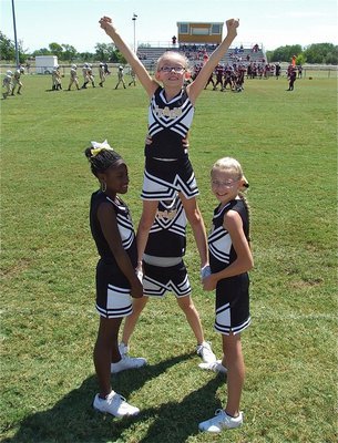 Image: The IYAA A-team cheerleaders perform a stunt to show all their hard work has paid off.