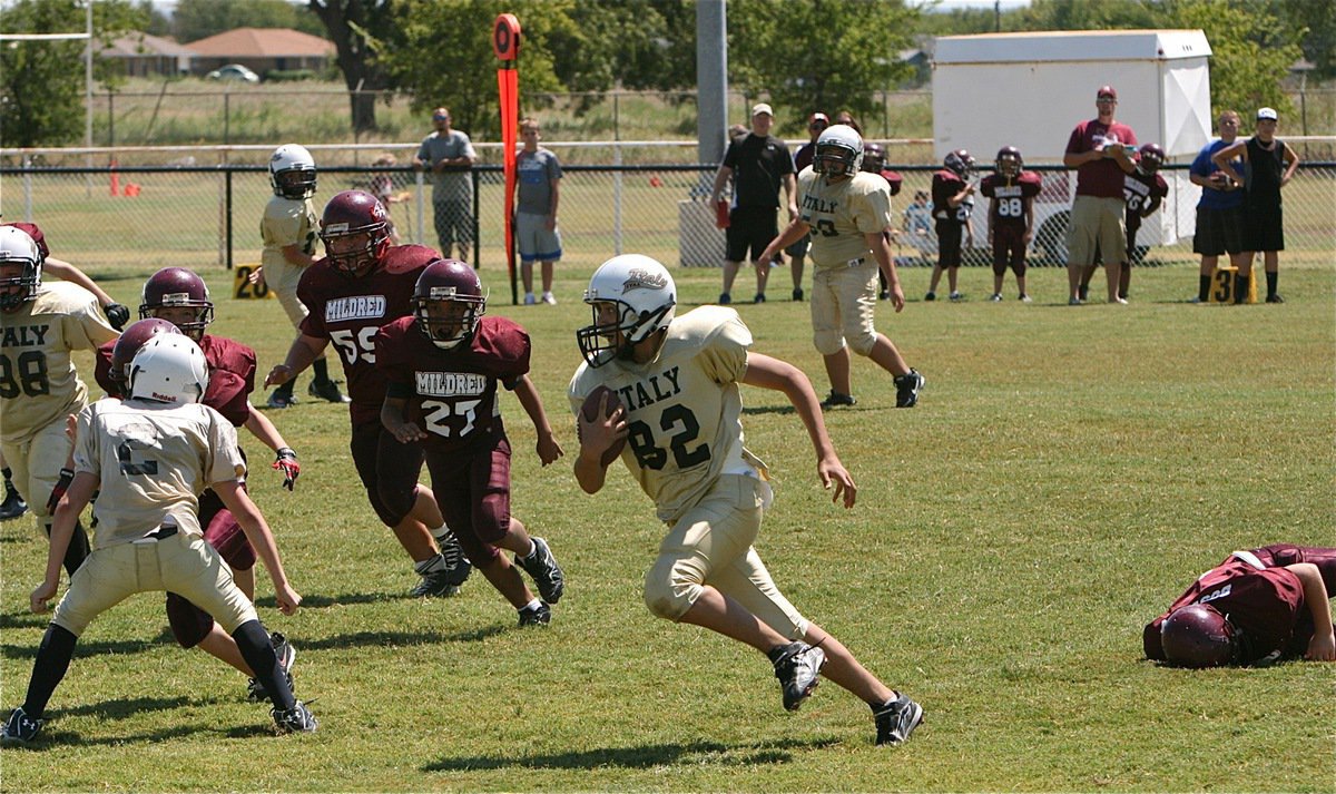 Image: IYAA A-Team defender Jonathan Salas(82) intercepts two Mildred passes during the season opener.