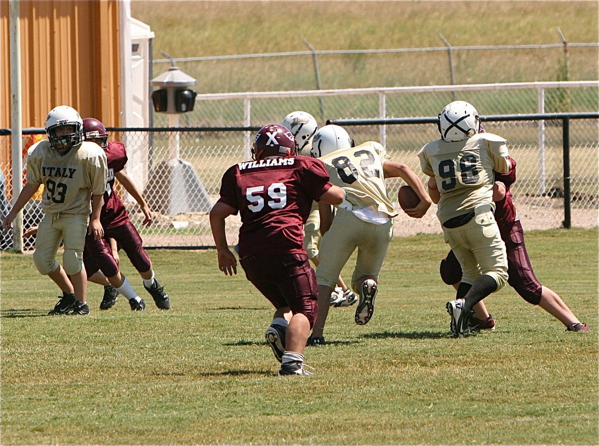 Image: Jonathan Salas(82) follows his blocking into the end zone during the A-team game against Mildred.