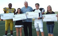 Image: Dale Hansen presents academic scholarships to Italy’s Paul Harris and Morgan Cockerham and to Malakoff’s Olin Taylor and Baylie Sims. Each recipient received $1,000.00. Overall $12,000.00 in scholarships were presented during the inaugural 2012 Dale Hansen Football Classic.
