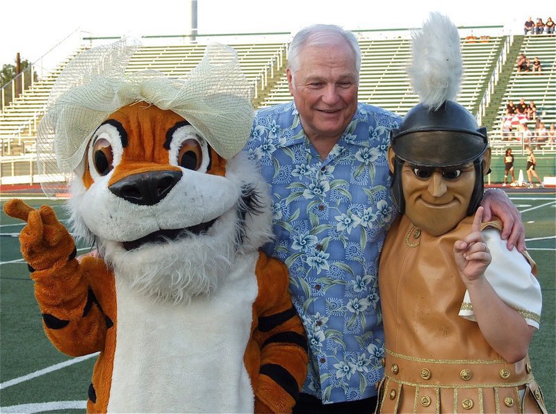 Image: Dale Hansen and the team mascots before the start of the Friday night addition of the inaugural 2012 Dale Hansen Football Classic between Malakoff and Italy. Representing the Gladiators is mascot Reagan Adams.