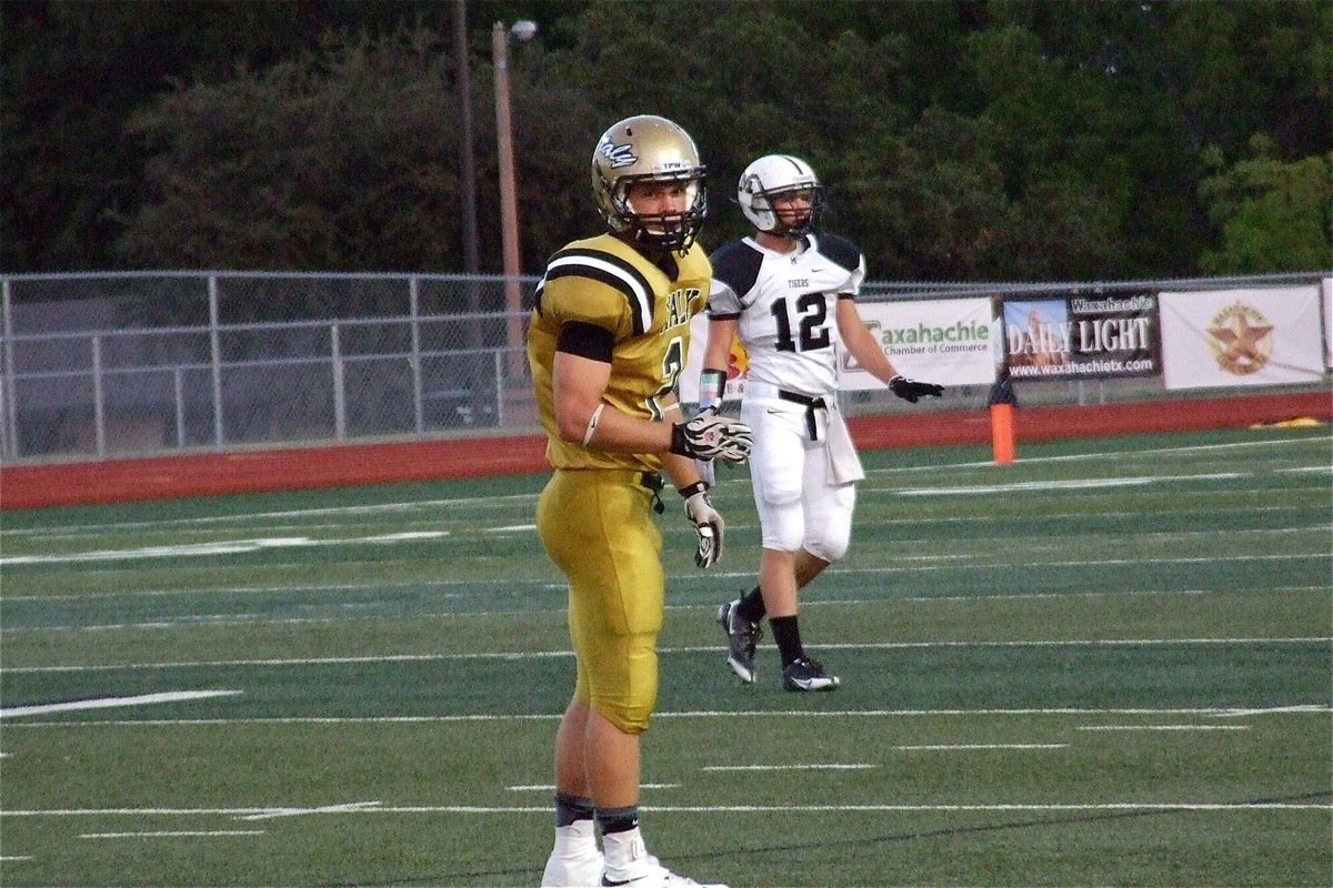 Image: Chase Hamilton(2) looks to the sideline for the offensive call.