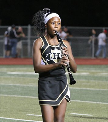 Image: K’Breona Davis trades her pom-poms for the clarinet during halftime.