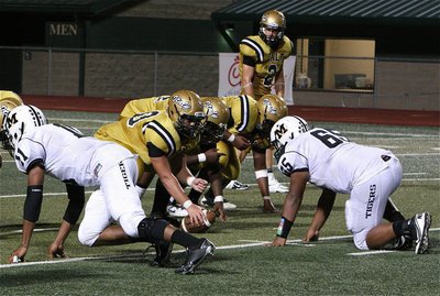 Image: Center Zain Byers(50), left guard Adrian Reed(64), left tackle Darol Mayberry(58) and slot receiver Chase Hamilton(2) get ready to run a play.