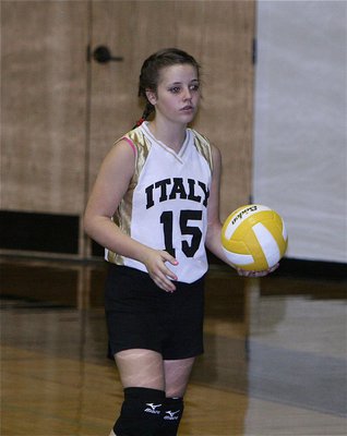Image: 8th grader Peyton Bowles warms up before Italy’s match with Milford.