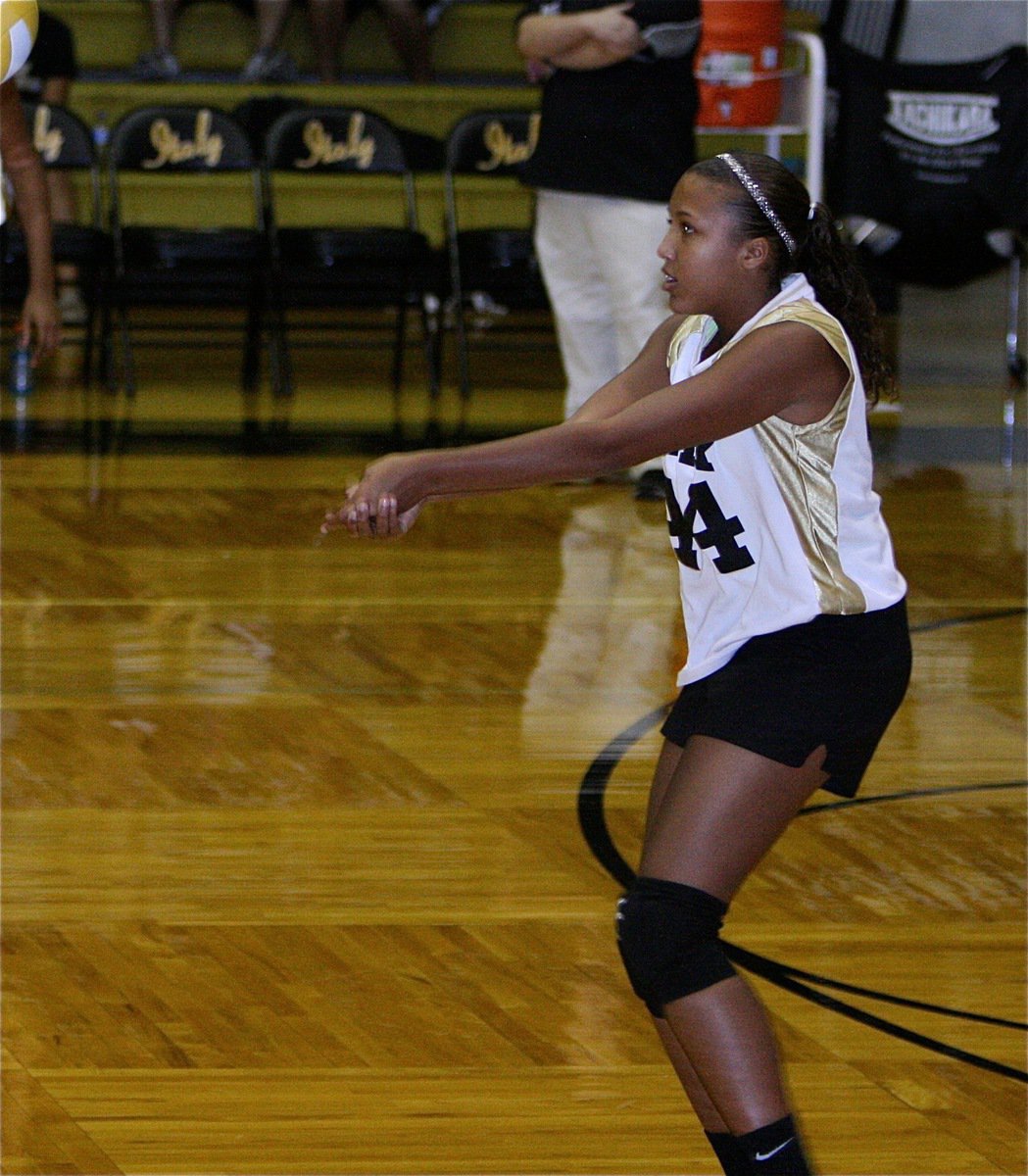 Image: Emmy Cunningham bumps the ball back over the net for Italy’s 8th grade squad.