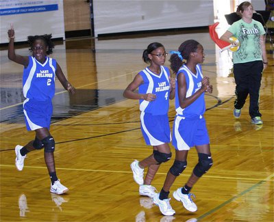 Image: The Milford 8th grade girls squad takes the floor while pumping up their dog pound!