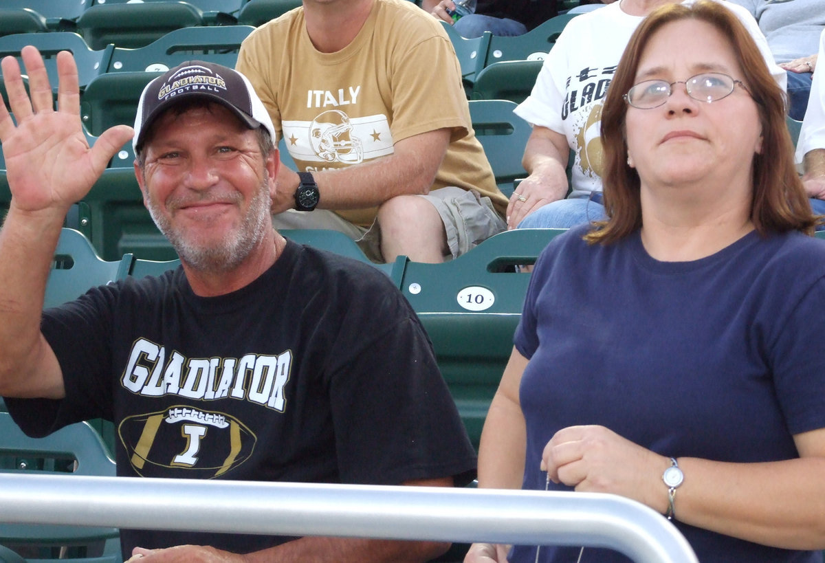 Image: Lee Hamilton and his sister Tracy Hamilton show their support for Lee’s son Chase Hamilton who is a senior athlete for the Gladiators. Lee also played for the Gladiators, just a few years back, and Tracy was a cheerleader.