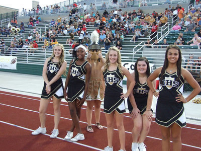 Image: The Lady Gladiator Cheerleaders keep the spirit up on the sidelines at Stuart B. Lumpkins Stadium in Waxahachie.