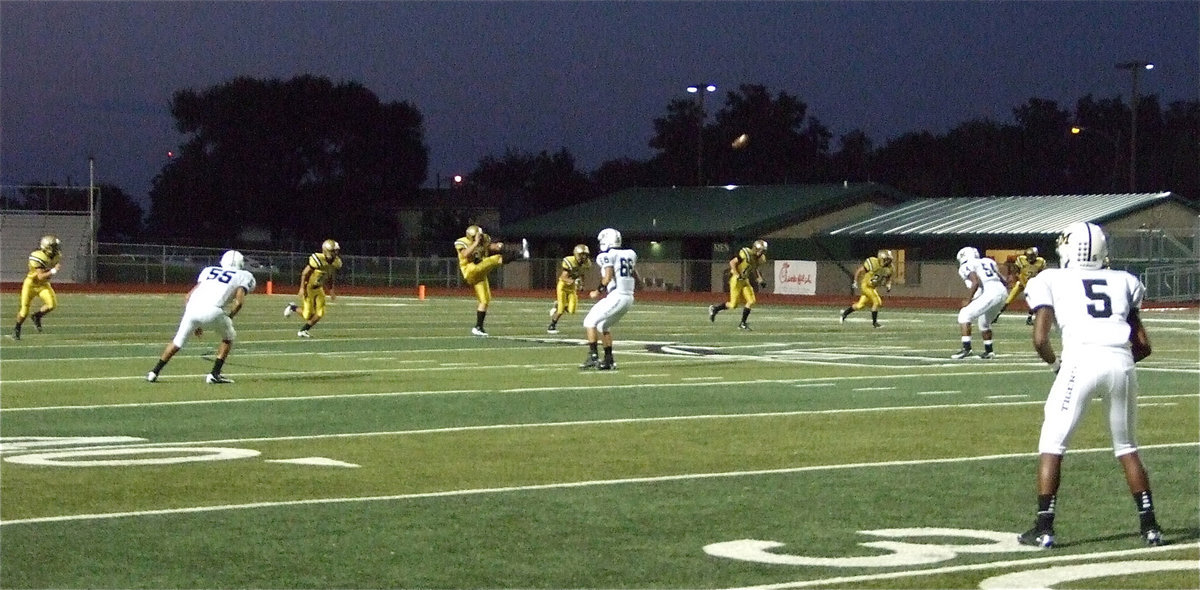 Image: Kevin Roldan(60) kicks off to the Tigers.