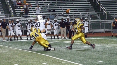 Image: Justin Wood(44) forces Malakoff’s quarterback to throw the ball away.