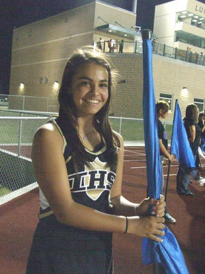 Image: IHS cheerleader Ashlyn Jacinto is also a member of the color guard.