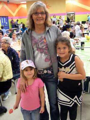 Image: Debbie McGuire and her two granddaughters Mayson and Taylor.