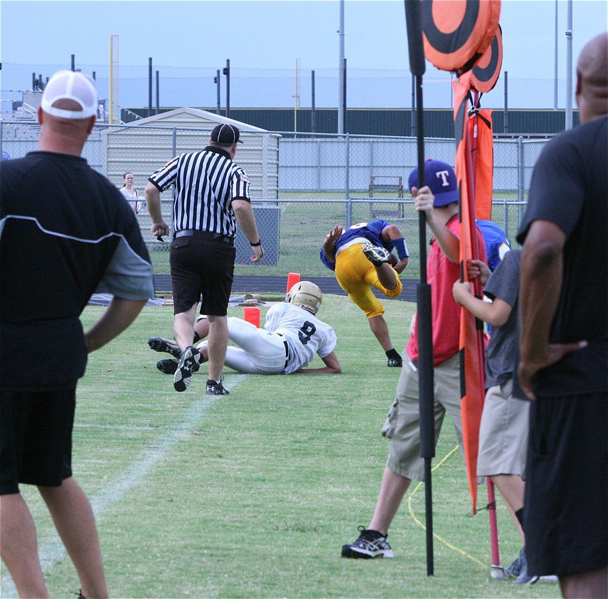 Image: Devonteh Williams(9) forces out a Raider running back while Coach Hank Hollywood puts a little english on the play by Williams.