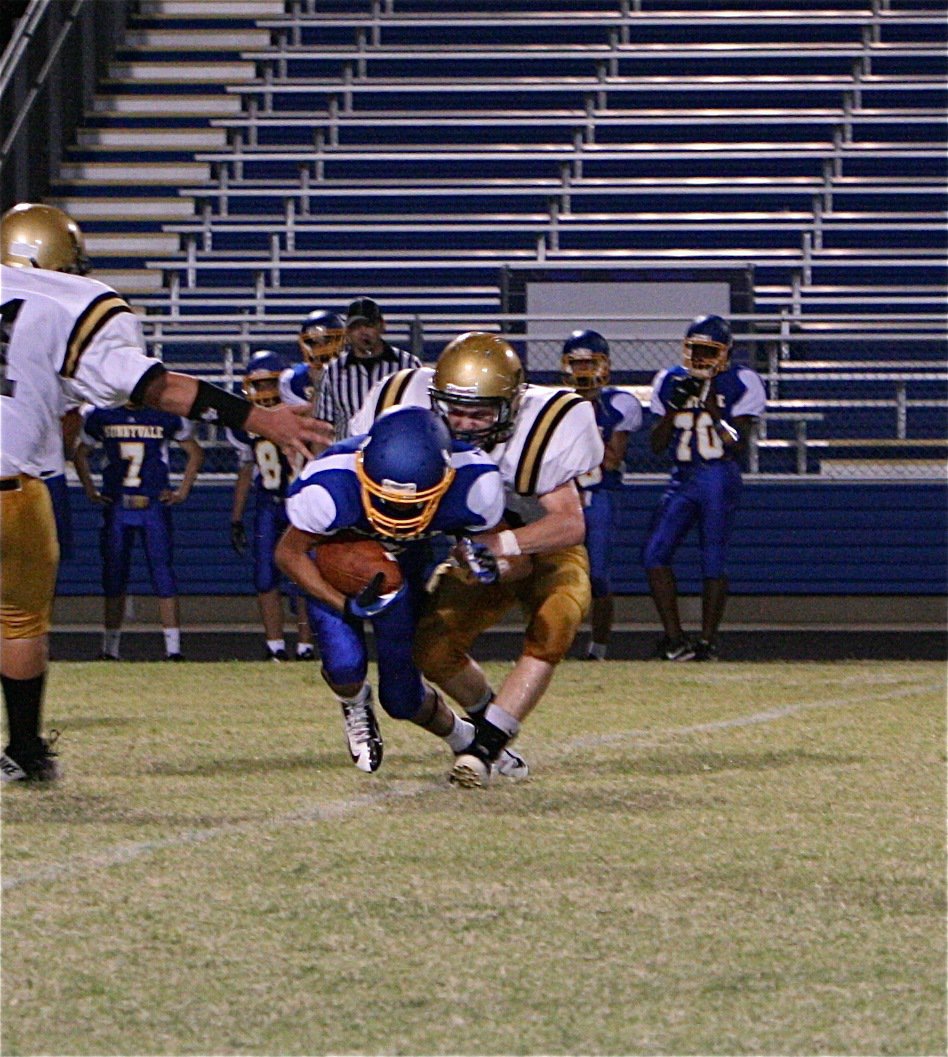 Image: John Escamilla(63) rides a Raider ball carrier for 2.7 seconds before getting him to the ground.