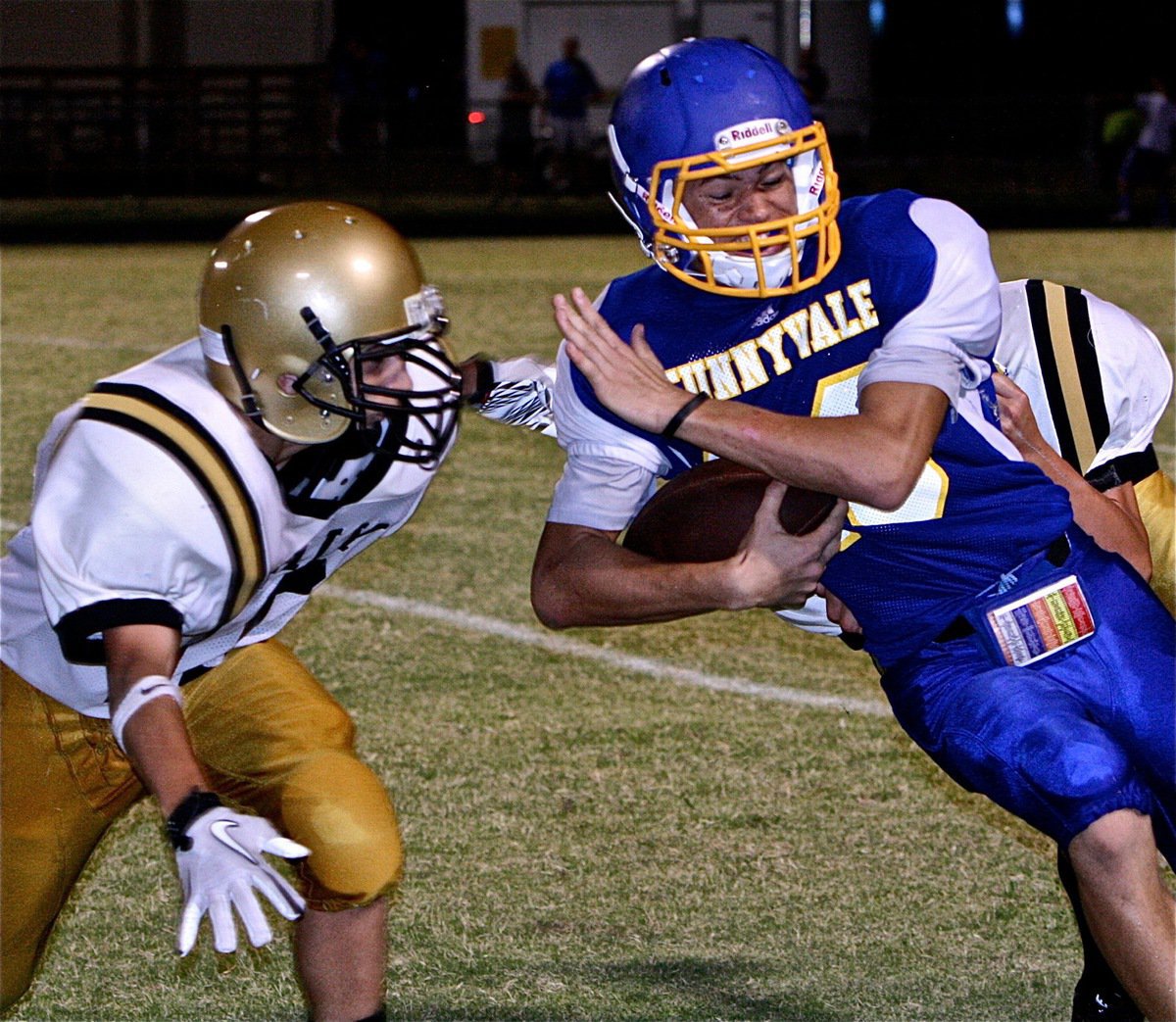 Image: Levi McBride(10) helps his teammate knock a Sunnyvale player out-of-bounds.