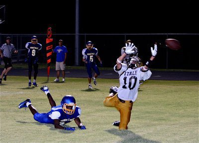 Image: Levi McBride(10) gets tripped up trying to make the game winning catch for Italy in the back of the end zone allowing Sunnyvale to hold on for a 23-20 win.