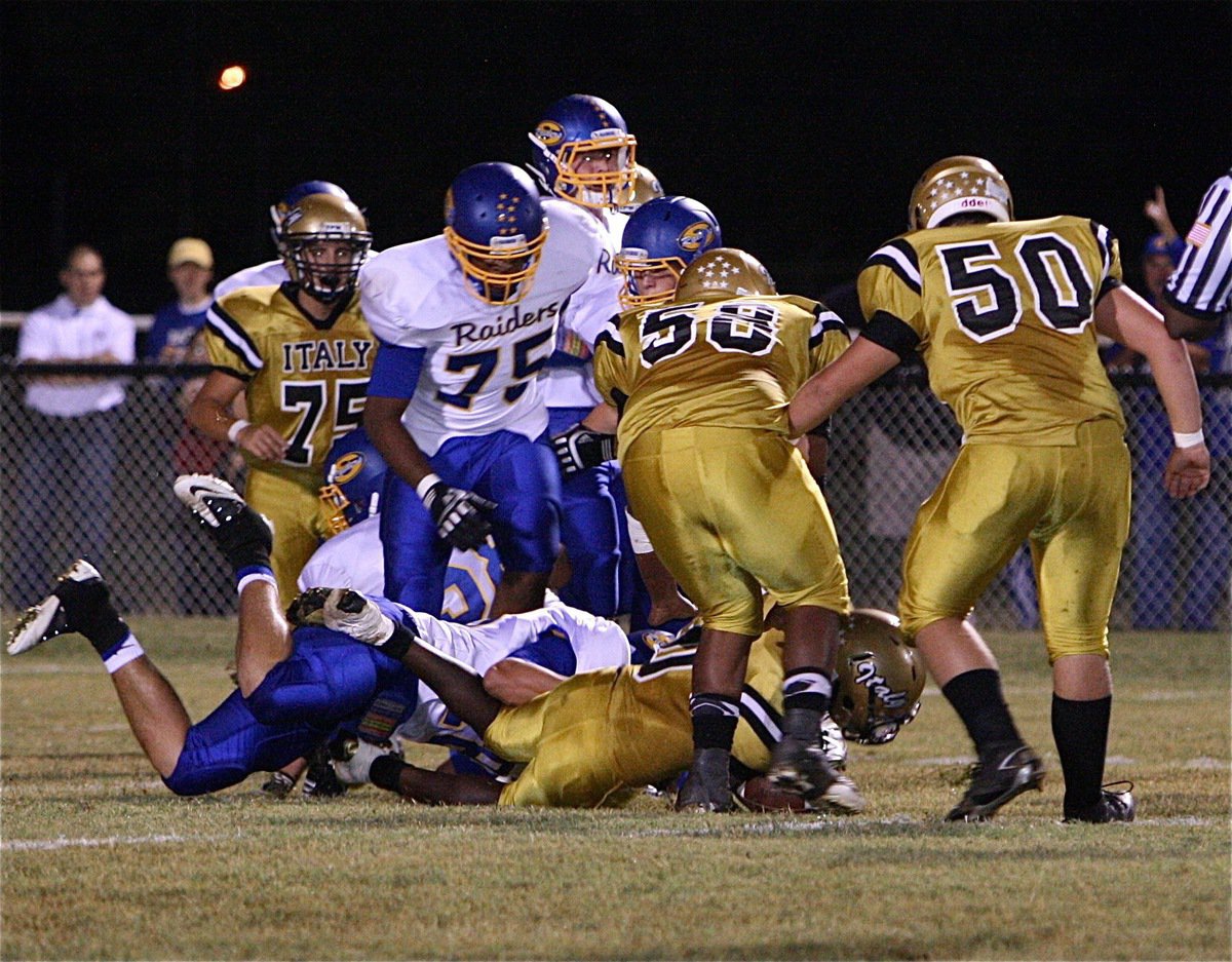 Image: Ryheem Walker(10) dives for extra yardage.