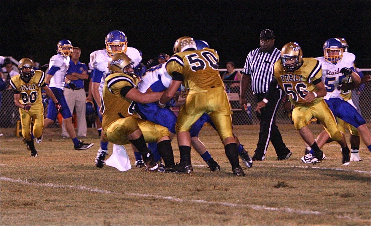 Image: Italy’s Kevin Roldan(60) makes the tackle at the line-of-scrimmage.