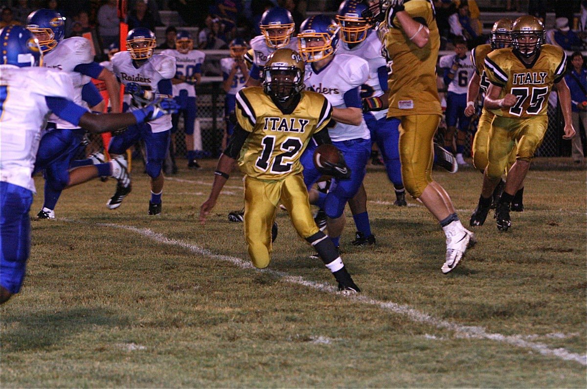 Image: Eric Carson(12) scrambles for yardage thru Sunnyvale’s defense.