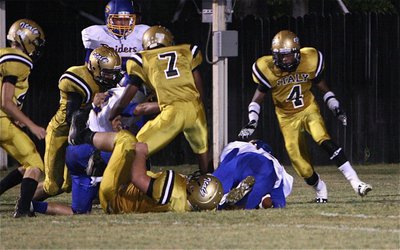 Image: Justin Wood(44), Darol Mayberry(58), Paul Harris(7), Zain Byers(50) and Trevon Robertson(4) try to keep Sunnyvale out of the end zone.