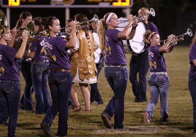 Image: Jennifer, Amber, Maddy and Tara multi-task during the band’s halftime performance.