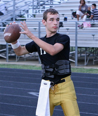 Image: Gladiator JV quarterback Ryan Connor warms up before his squad’s matchup against Sunnyvale.