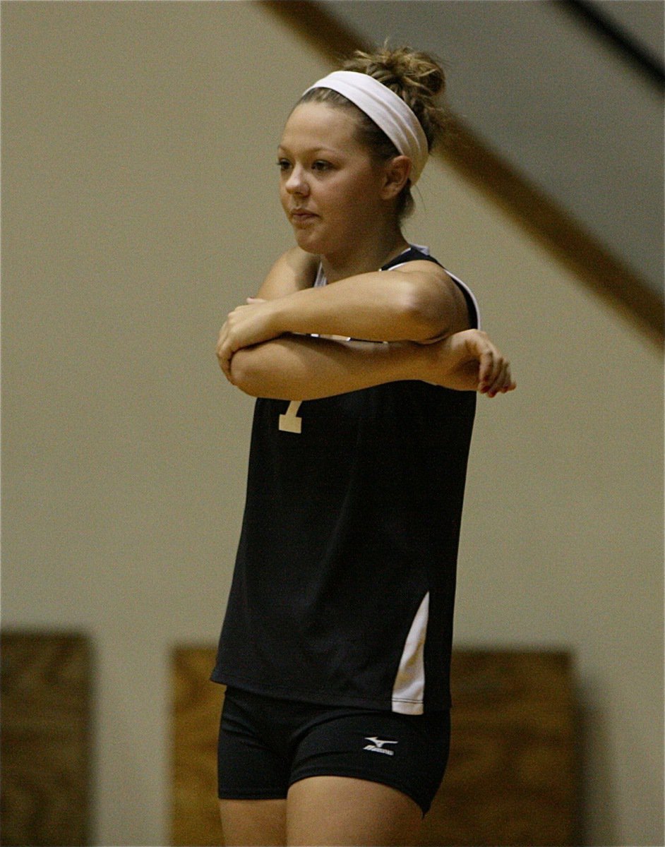 Image: Lady Gladiator Bailey Eubank(7) gets her stretch on before taking on Kopperl.