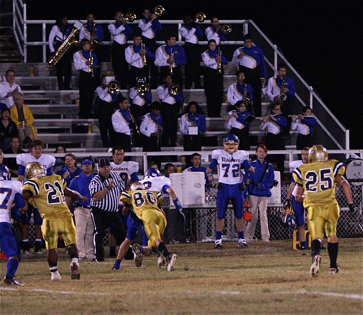 Image: Italy’s Kelvin Joffre(80) tackles a Raider receiver on the far side of the field.