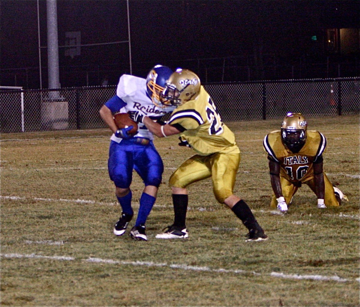 Image: Gladiator junior Shad Newman(25) pulls down a Raider back.