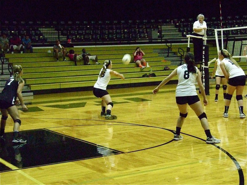 Image: Jaclynn Lewis(15) slides over for a dig.