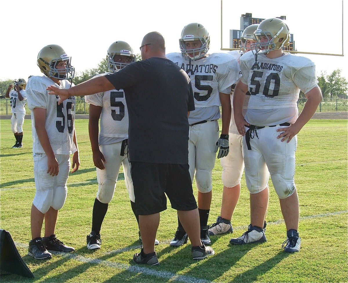 Image: Line coach Brandon Duncan instructs Elliott Worsham(56), Kenneth Norwood, Jr.(54), David De La Hoya(55), Austin Pittmon(51) and Aaron Pittmon(50).