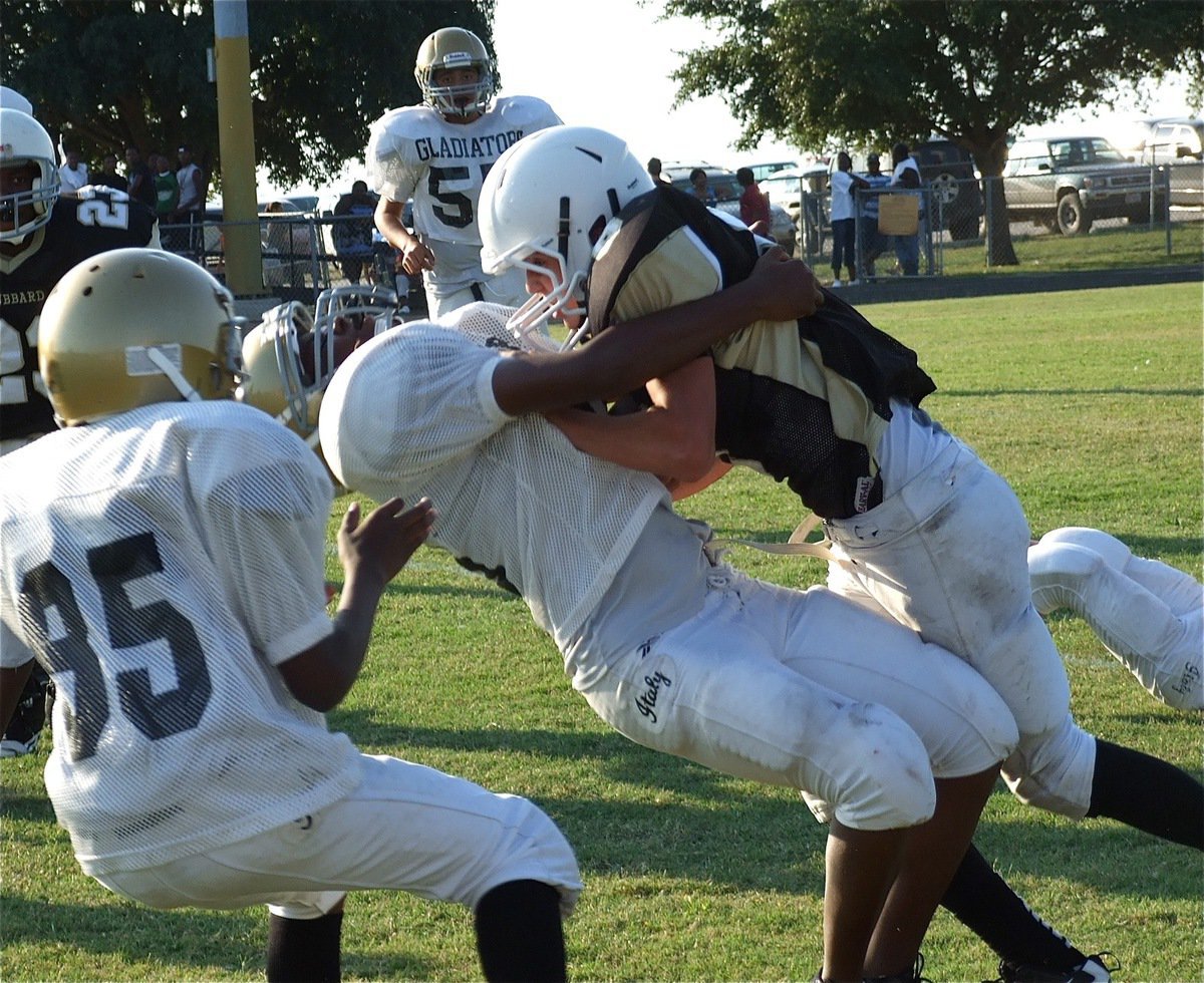 Image: Jarvis Harris(89) collides with a Hubbard back and drops the Jaguar for no gain.