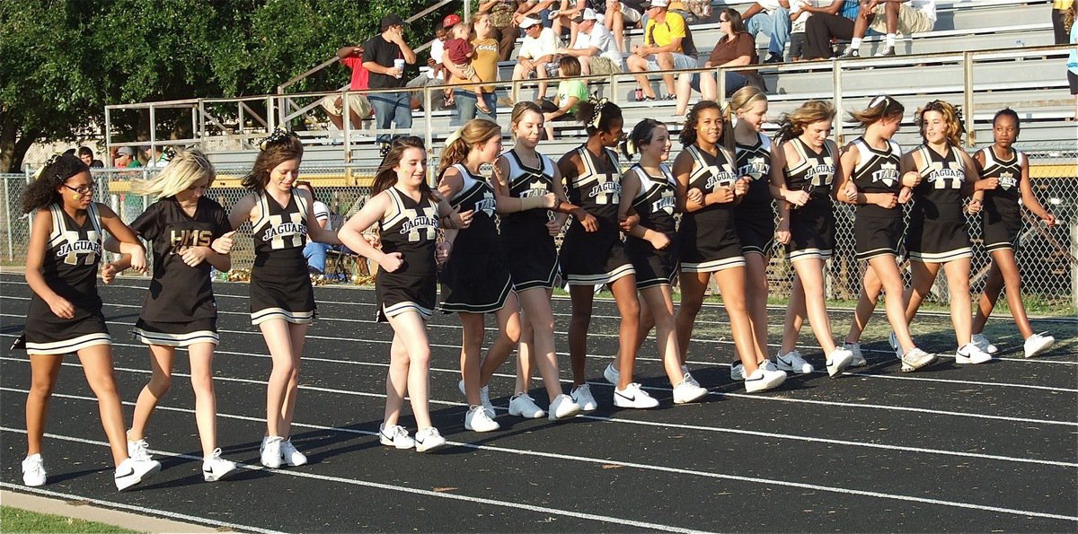 Image: The Hubbard Cheerleaders escort Italy’s Cheerleaders to the Jaguar side of the field.