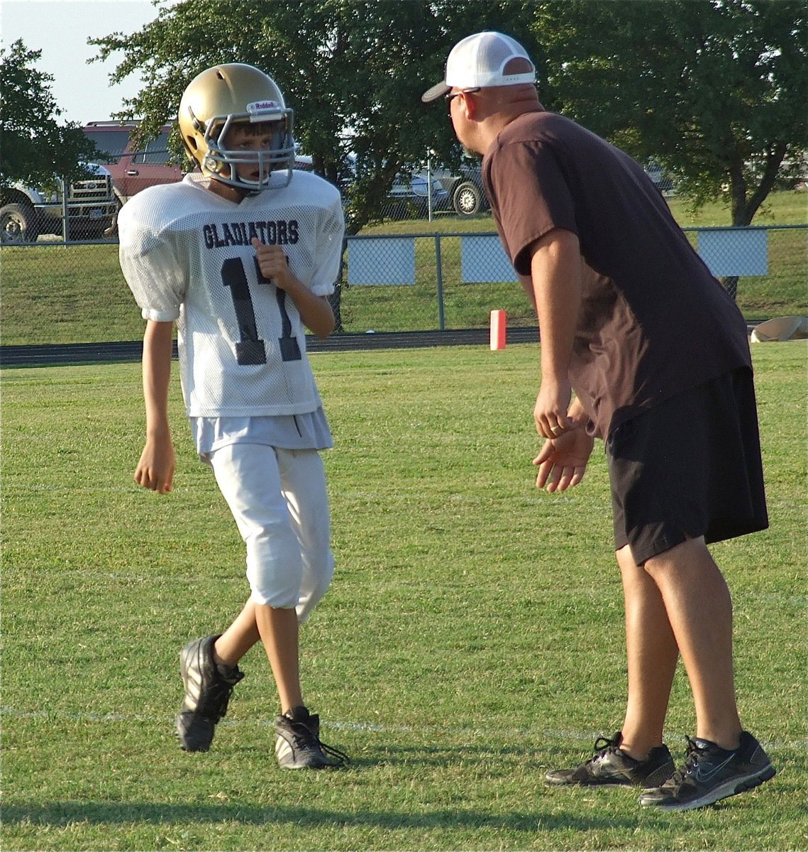 Image: Italy’s Ty Hamilton(17) gets the defensive adjustment from Coach Hank Hollywood.