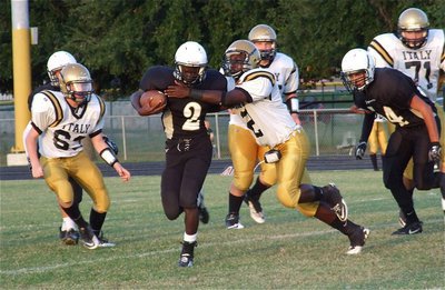 Image: Marvin Cox(2) closes down running lane against Hubbard.