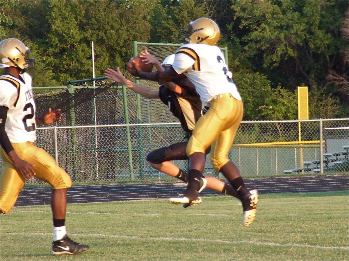 Image: Marvin Cox(2) intercepts a Jaguar pass attempt at the 5-yard line.