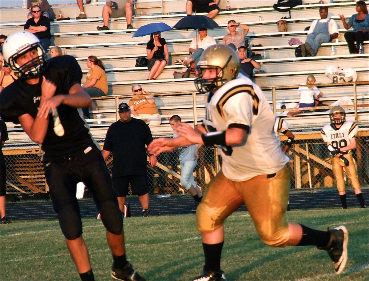 Image: Defensive tackle John Byers(75) pressures Hubbard’s quarterback into throwing an incomplete pass. Byers would later blind side the defenseless Q.B. to force another pass into the dirt.